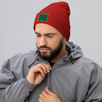 photo of a man wearing red beanie with the red seat logo in green and red embroidered on the cuff