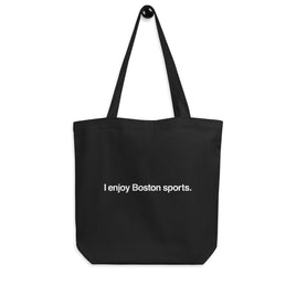 black tote bag with the words "i enjoy boston sports" written in white helvetica font