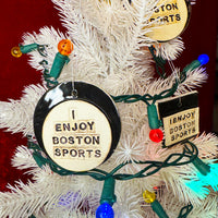 photo of white christmas tree with white and black porcelain ornaments that say, i enjoy boston sports