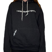 black unisex hoodie with the words i enjoy boston sports in white with the red seat logo