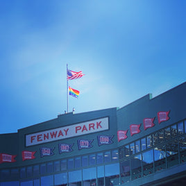 Photograph of the inside of fenway park boston red sox pride flag with american flag