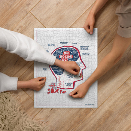 people playing with jigsaw puzzle with the red seat design of the mind of a red sox fan inspired by phrenology