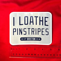 photo of car decal waterproof vinyl sticker of I Loathe Pinstripes-The Red Seat grey design with boston world series wins Yankees Suck with a ruler on red background