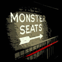Monster Seats The Red Seat Design with the words Monster Seats painted on a wall fenway park boston