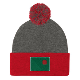 photo of a grey and red pom pom beanie with the red seat logo in green and red embroidered on the cuff
