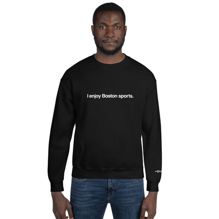 man wearing black unisex crewneck sweatshirt with the words i enjoy boston sports in white on the front