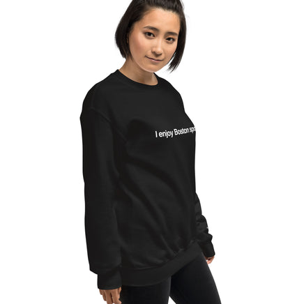 woman wearing black unisex crewneck sweatshirt with the words i enjoy boston sports in white on the front