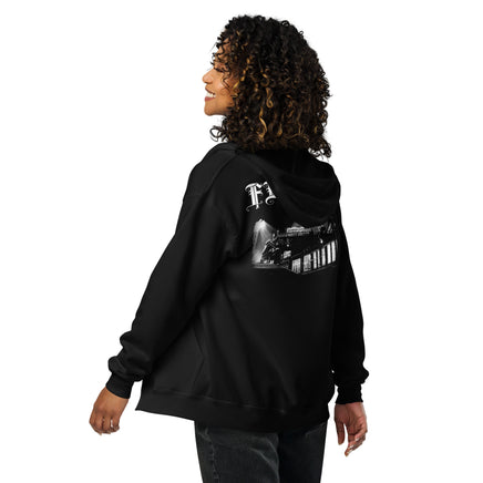 Woman wearing the Fenway Gothic zip hoodie, back view showing the Fenway Park print