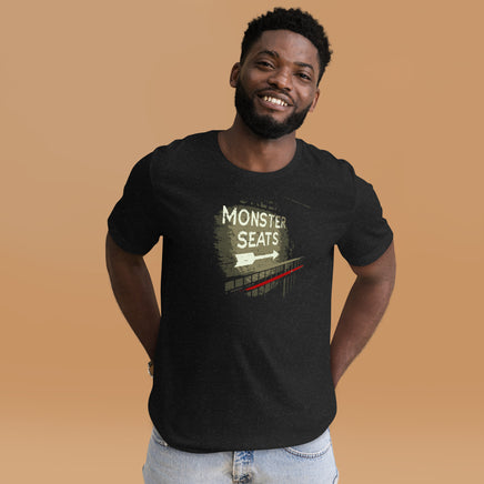 photograph of man wearing Monster Seats-The Red Seat Design with the words Green Monster Seats painted on a wall fenway on black unisex t-shirt park boston
