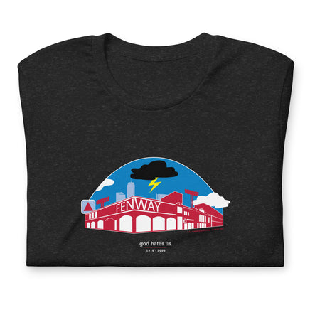 black folded unisex t-shirt with a red and blue design of boston red sox fenway park with a black cloud and the words "god hates us"
