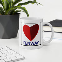 white ceramic mug with the boston fenway citgo sign in the shape of a heart in an office