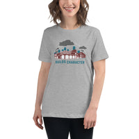 photo of woman wearing grey women's t shirt with the red seat building character design of the boston red sox fenway park.