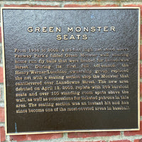 photograph of the plaque in fenway park describing the boston red sox green monster seats