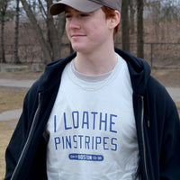 photograph of man wearing I Loathe Pinstripes-The Red Seat grey t-shirt with boston world series wins Yankees Suck