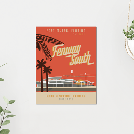 11x14 Fenway South art print with red background and jetblue park with palm trees. Mounted on a grey wall with plants nearby