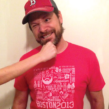 man wearing red t-shirt red sox design from 2013 with many memorable moments