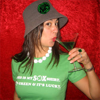 woman wearing The Lucky Sox Shirt-The Red Seat Green background st patrick's day design