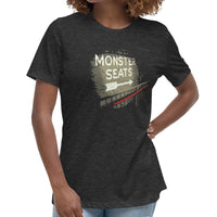 woman wearing Monster Seats-The Red Seat Design with the words Monster Seats painted on a wall fenway park boston women's black t-shirt